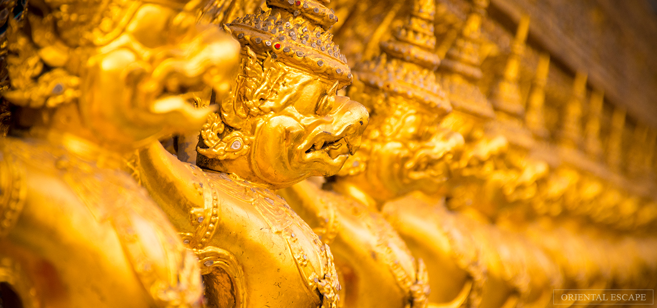 Golden decorative figures at the Grand Palace in Bangkok